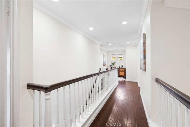 corridor featuring ornamental molding and dark hardwood / wood-style flooring