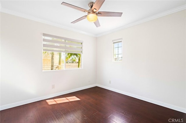 unfurnished room featuring hardwood / wood-style floors, crown molding, a wealth of natural light, and ceiling fan