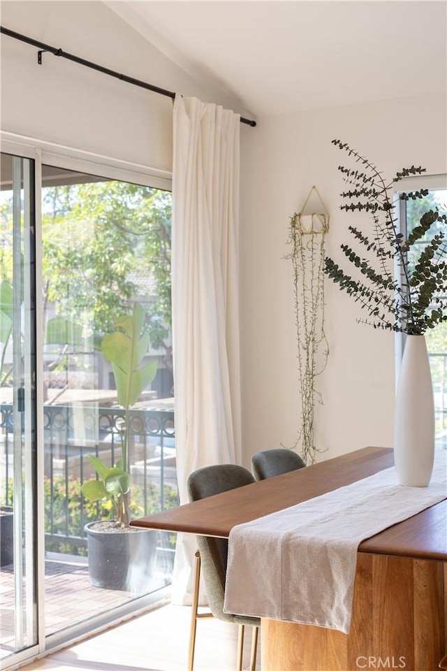 dining area with lofted ceiling