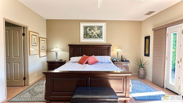 tiled bedroom with access to outside