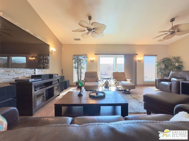 living room featuring light tile patterned flooring and ceiling fan