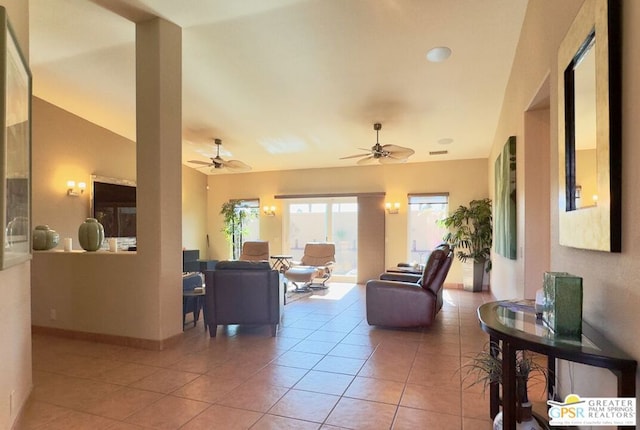 tiled living room featuring ceiling fan