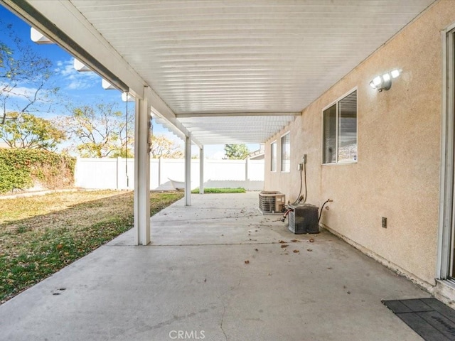 view of patio / terrace featuring central air condition unit and a fenced backyard