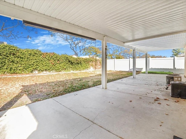 view of patio / terrace with a fenced backyard and central AC