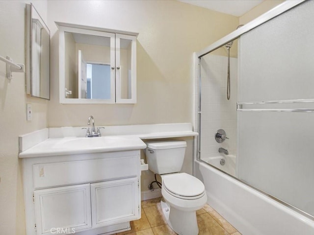 bathroom featuring bathing tub / shower combination, vanity, toilet, and tile patterned floors