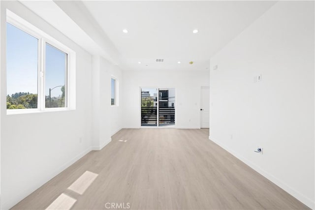 unfurnished room with light hardwood / wood-style floors