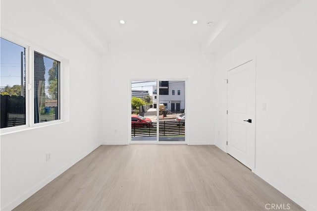 spare room featuring light hardwood / wood-style floors