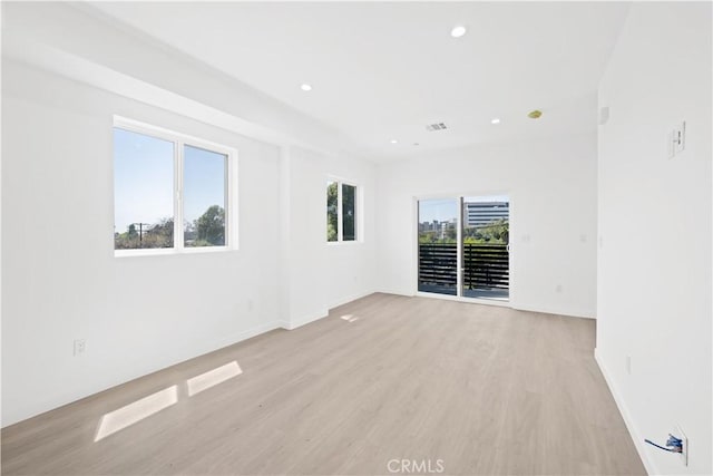 empty room with light wood-type flooring