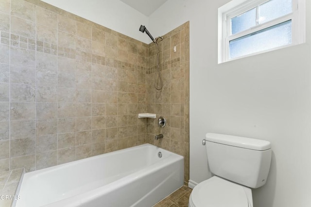 full bath with shower / bath combination, tile patterned flooring, and toilet