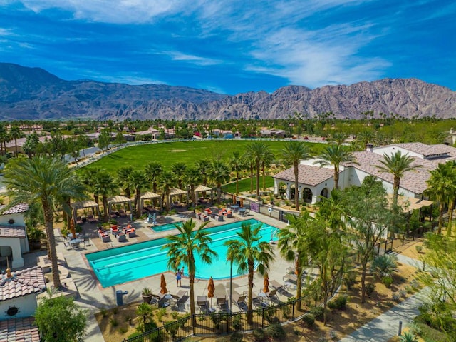 view of pool featuring a mountain view and a patio area