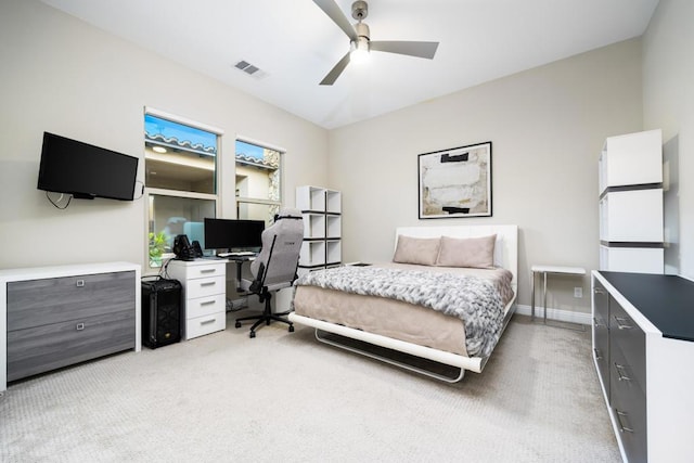 bedroom featuring light carpet and ceiling fan