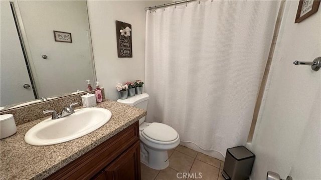 bathroom featuring vanity, curtained shower, tile patterned floors, and toilet