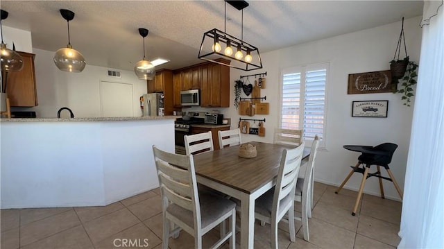 tiled dining area with sink