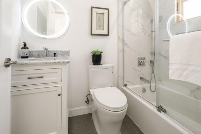 full bathroom with vanity, combined bath / shower with glass door, and toilet