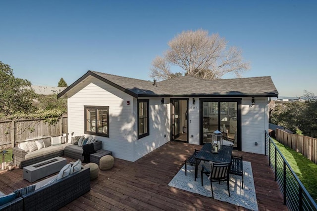 wooden terrace featuring an outdoor living space