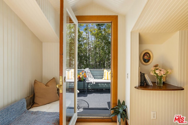 doorway with lofted ceiling