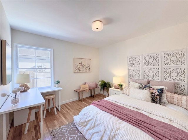 bedroom featuring light wood-type flooring