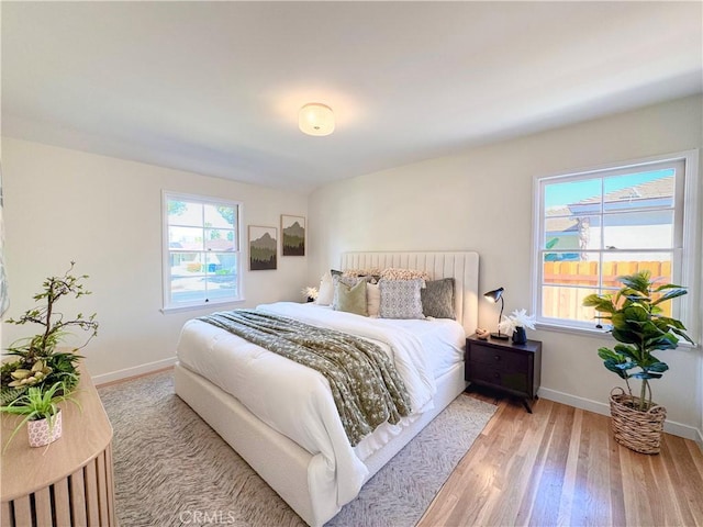 bedroom with light wood-type flooring