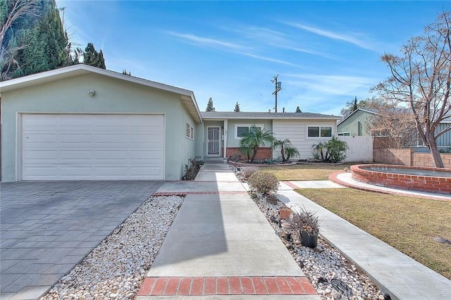 single story home with a garage