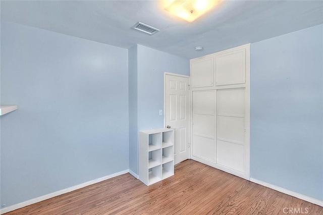 interior space featuring light hardwood / wood-style floors and a closet