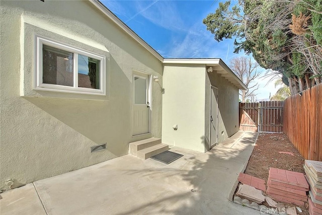 entrance to property with a patio