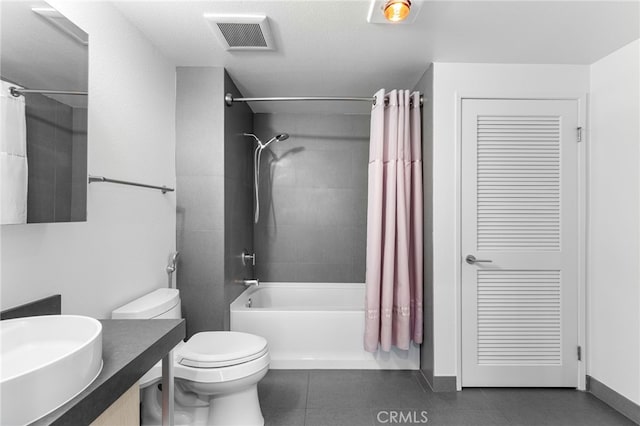 full bathroom with shower / bathtub combination with curtain, vanity, tile patterned floors, and toilet