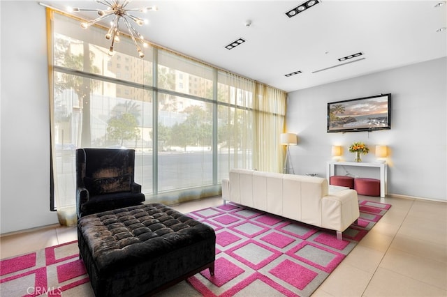 tiled living room featuring an inviting chandelier