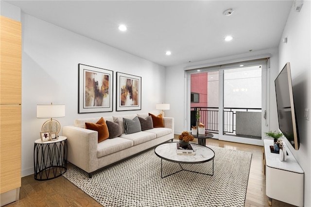 living area featuring recessed lighting and wood finished floors