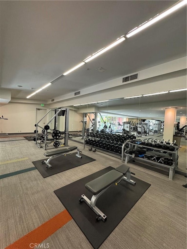 workout area with carpet floors and visible vents
