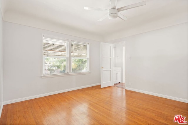 empty room featuring light hardwood / wood-style flooring and ceiling fan