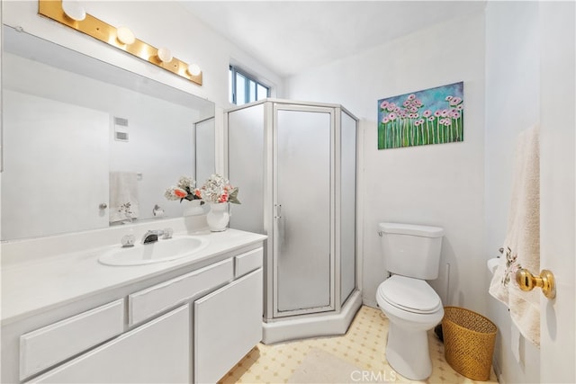 bathroom featuring walk in shower, vanity, and toilet