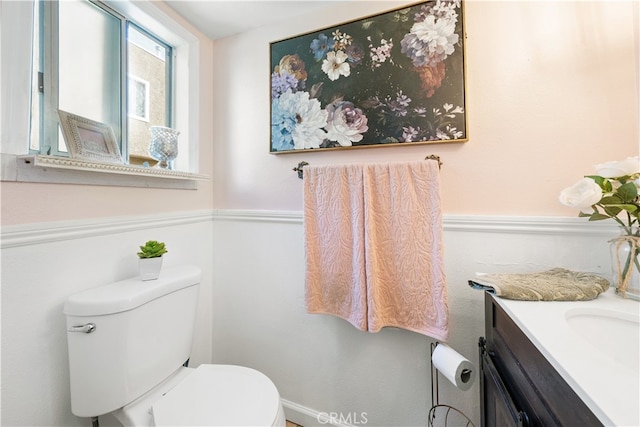 bathroom featuring vanity and toilet