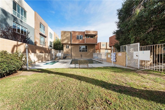 view of yard with a community pool and a patio area