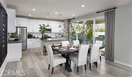 14224 Hartford St, Hesperia, CA 92345 - dining room featuring light hardwood / wood-style floors