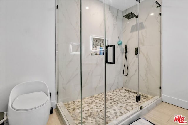 bathroom with toilet and walk in shower