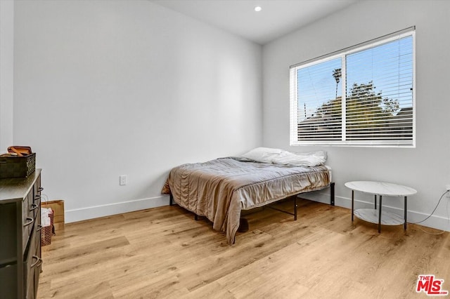 bedroom with light hardwood / wood-style flooring