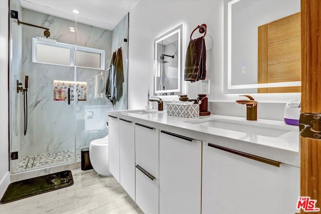 bathroom with vanity, toilet, and an enclosed shower