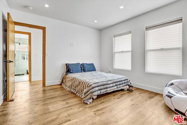 bedroom featuring light hardwood / wood-style floors