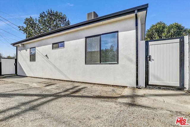 view of property exterior featuring a patio area