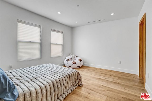 bedroom with light wood-type flooring