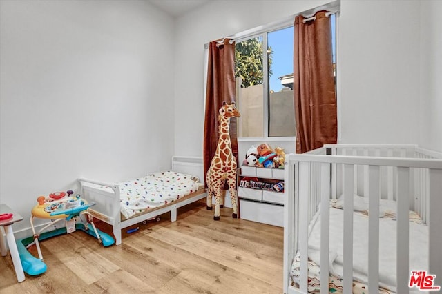 bedroom featuring hardwood / wood-style floors