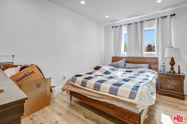 bedroom with light hardwood / wood-style floors