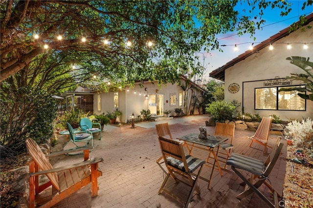 view of patio terrace at dusk