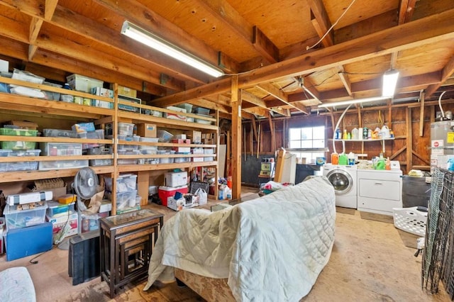 basement with washing machine and clothes dryer