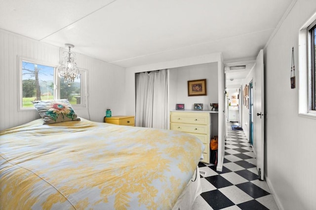 bedroom featuring a notable chandelier