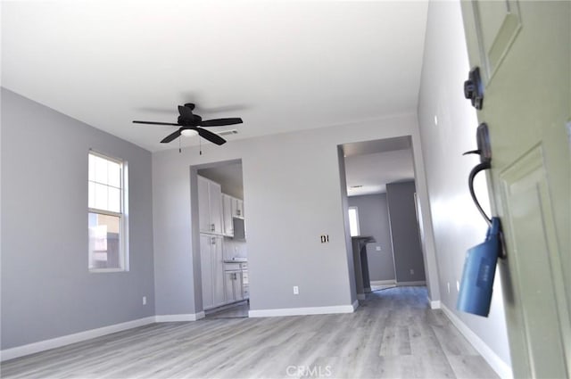 interior space featuring light hardwood / wood-style flooring and ceiling fan