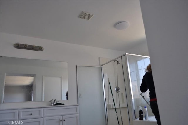 bathroom with vanity and an enclosed shower