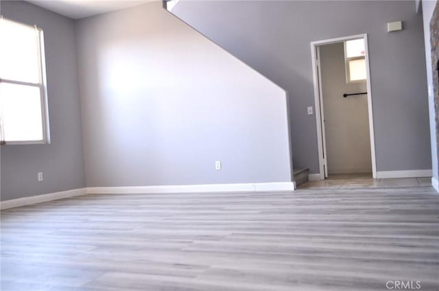 empty room with light hardwood / wood-style floors