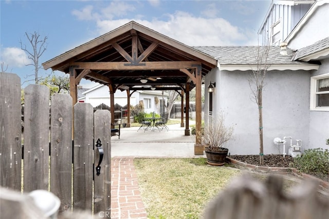 view of home's community with a gazebo and a patio