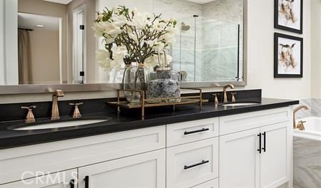 bathroom featuring vanity and an enclosed shower